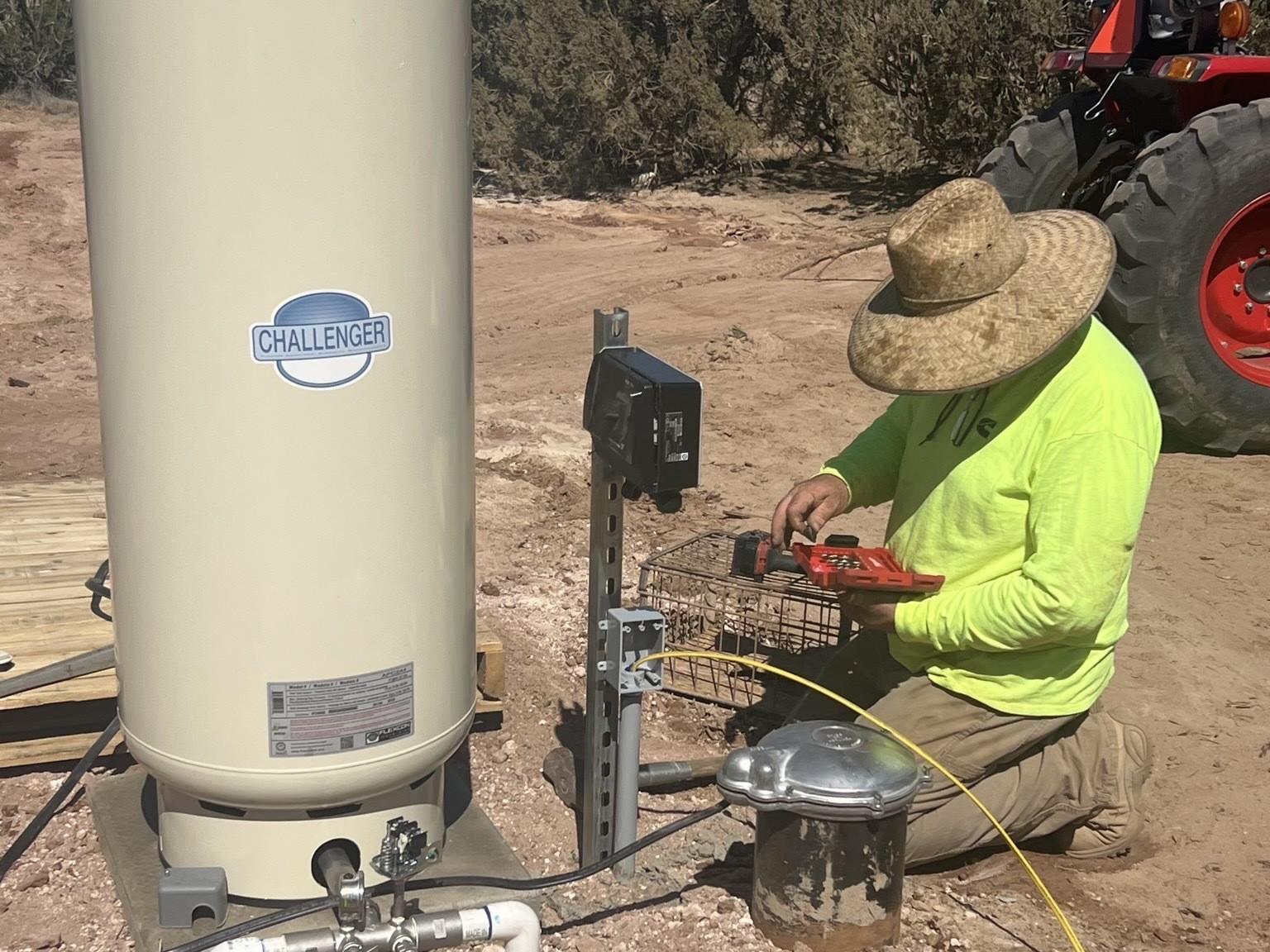 A man repairing a well pump